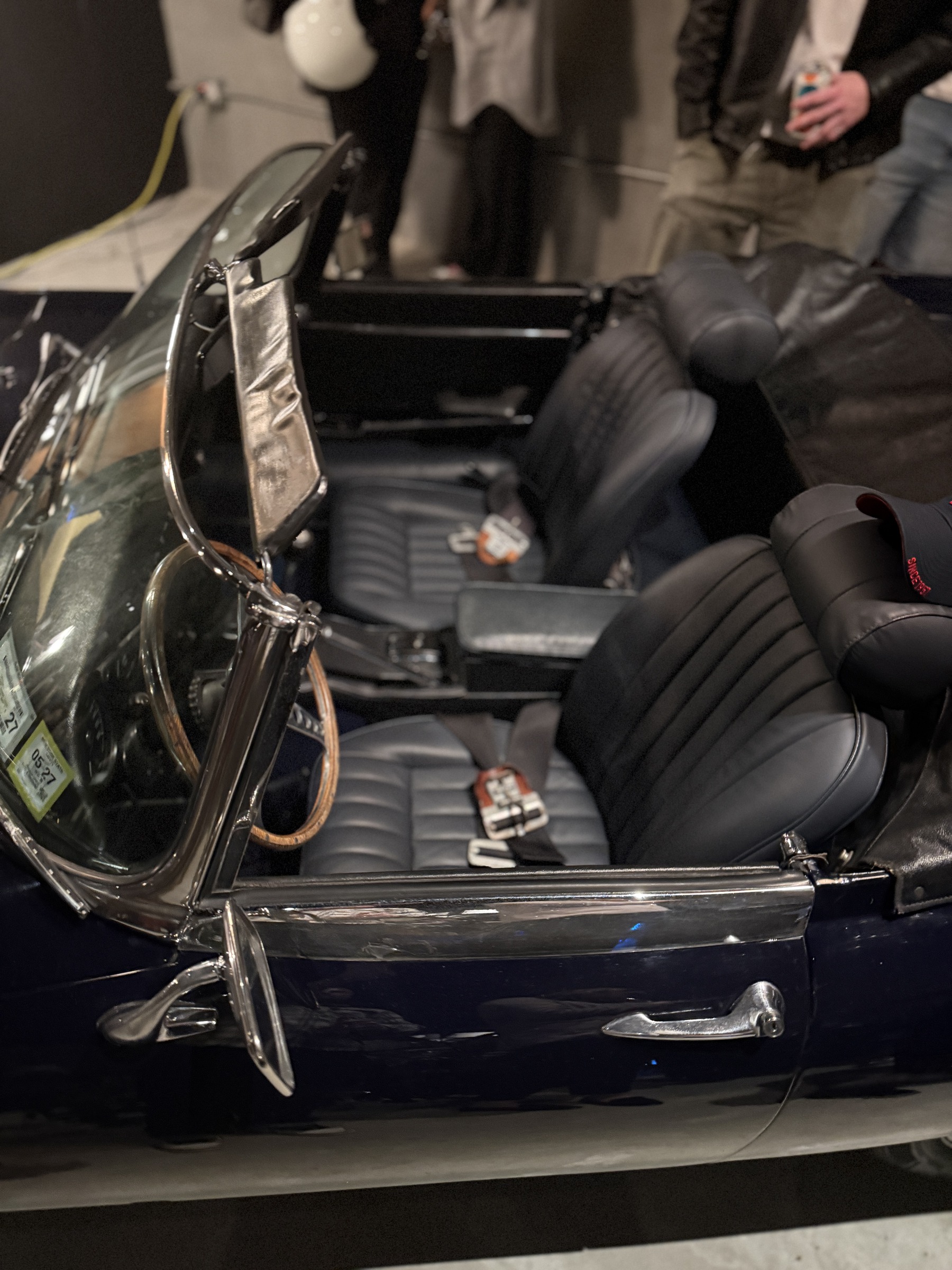The interior of the Jaguar, wood-rimmed wheel and leather seats